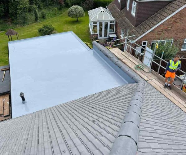 This is a photo of a newly installed hip roof, with a combined liquid covered flat roof. Work carried out by FCB Roofing Cranfield